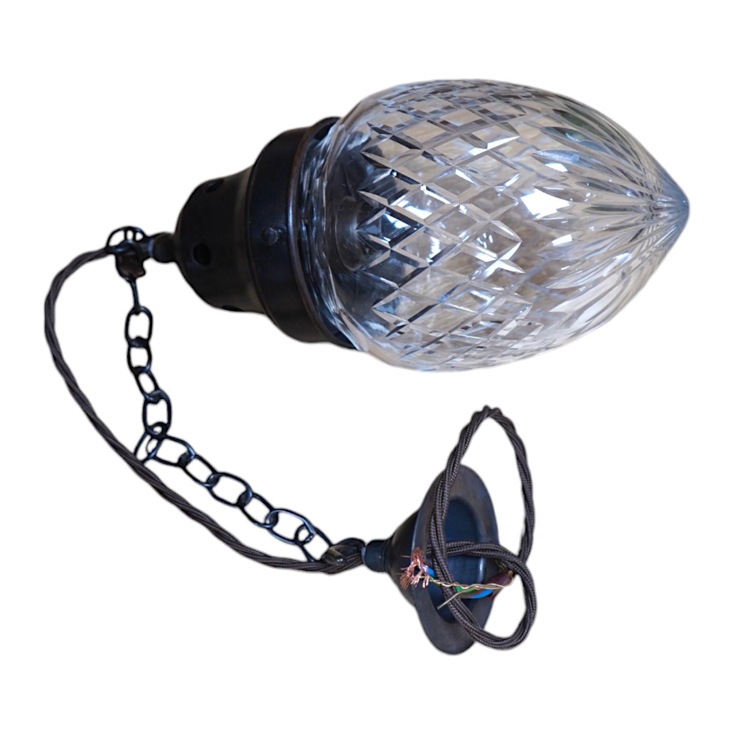 A 1920’s cut glass ceiling shade, with chain and rose, wired, glass including gallery 24cm high, 11cm across. Condition - good, not tested
